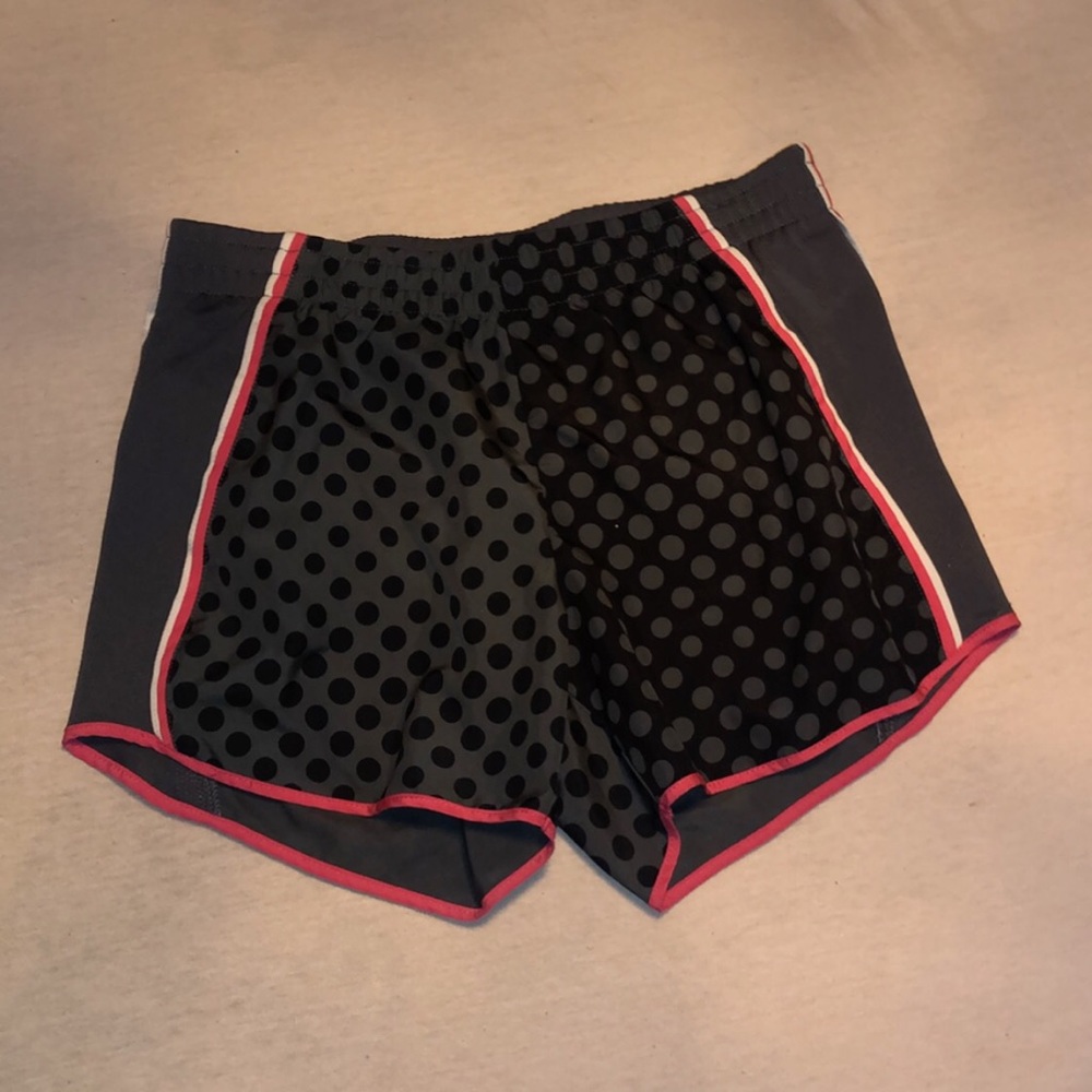 Grey and black nike shorts with pink details